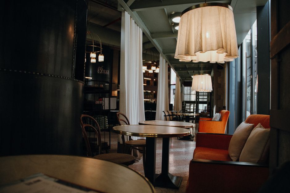 A warmly lit lounge interior with comfortable seating
